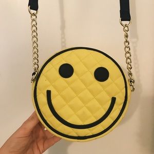 Betsey Johnson smiley face purse.